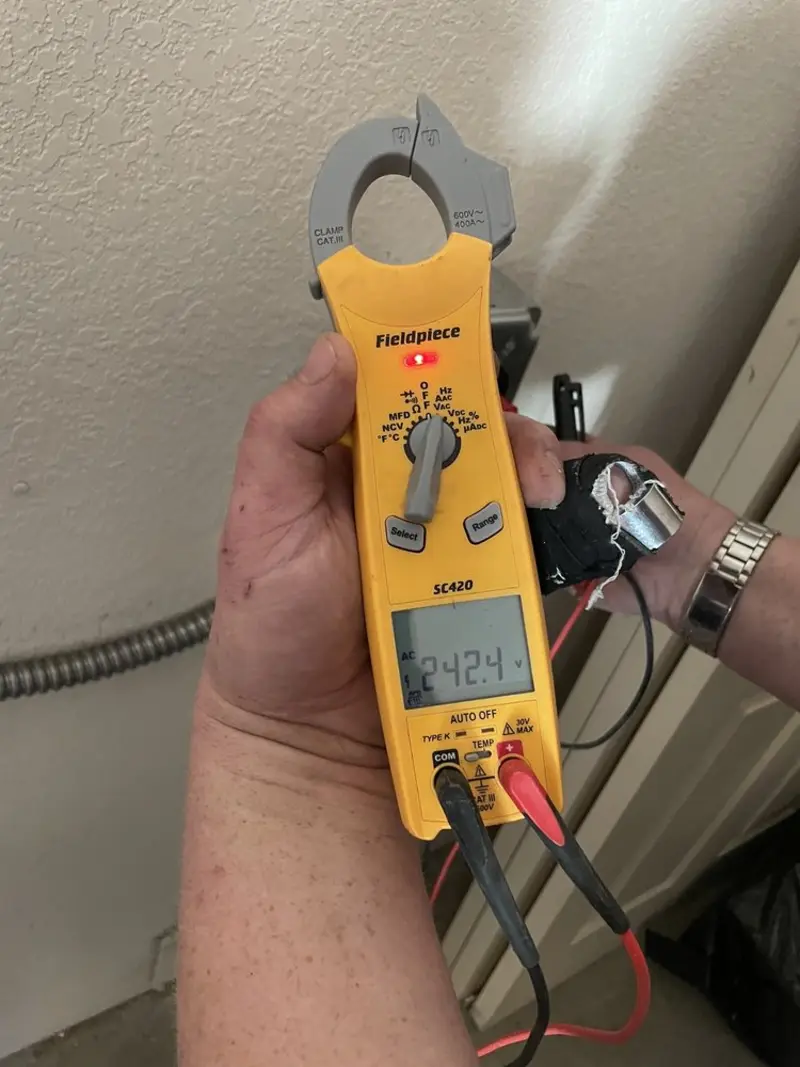 Voltage testing with clamp meter during Aluminum Wiring Replacement in Palisades Park